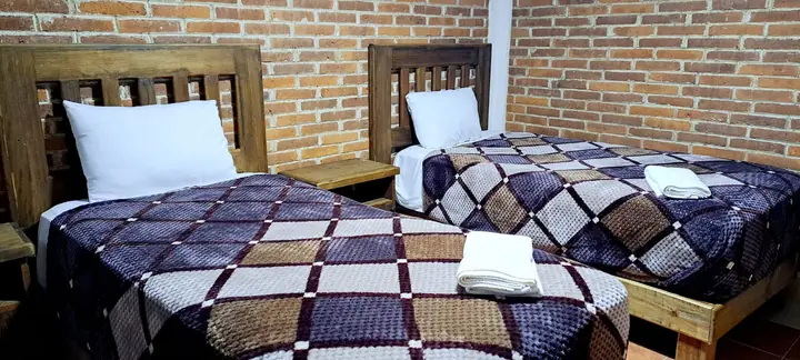 Cabaña Cuádruple, habitación con dos camas individuales